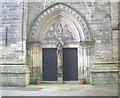 NZ2643 : West Door, St Cuthbert's Church by Stanley Howe