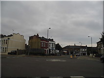 TQ2672 : Mini roundabout on Garratt Lane by David Howard