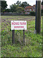 TG1915 : Home Farm sign by Geographer