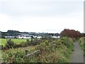 The modern sheds of the Bushmills Distillery viewed from the Bushmills cycle track