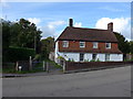 Looking across the A32 towards the footpath to the church