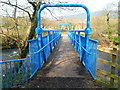 South side of a blue footbridge over the Afon Afan in Cwmavon