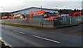 Orange machines outside Excavator House, Cinderford