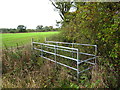 Footbridge on footpath between fields