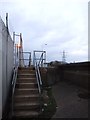 TQ9174 : Steps over Queenborough Wall by Chris Whippet