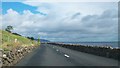 D3412 : The Antrim Coast Road south of the junction with Drumnagreagh Road  by Eric Jones