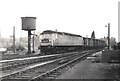 Brush Type 4 D1613 heads south from Shrewsbury with an express goods train