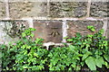 Benchmark on Swillington Park wall