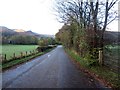 NY2423 : Looking along a country road towards Braithwaite by Graham Robson