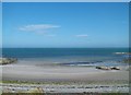 A small sandy bay between rocks off Springvale Road