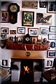M2132 : Moycullen - Handcraft Shop Interior - Fire in Fireplace & Photos on Wall by Joseph Mischyshyn