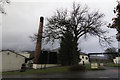 NN8649 : Tree and chimney by Peter Moore