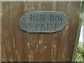TL3260 : New Inn Farm sign by Geographer
