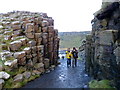 C9444 : Tourist at the Giant's Causeway by Kenneth  Allen