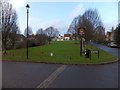 Village green and sign for Saxon Arms inn, Stratton