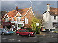 Shops and village sign, Churt