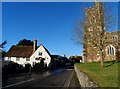 The White Hart pub, Brook Lane and St John the Baptist church, Flitton