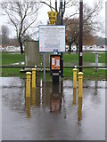 SZ1592 : Christchurch: car park ticket machine stands in floodwater by Chris Downer
