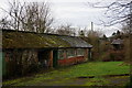 SK2268 : Brooklands, potting sheds and kitchen garden wall by Peter Barr