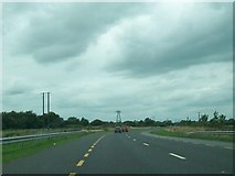 N3524 : Power lines running alongside the N52 on the eastern outskirts of Tullamore by Eric Jones