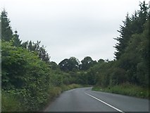 N6697 : Bend in the R165 east of Galbolie by Eric Jones