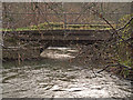 A bridge over the river Yeo at Orleigh Mills as seen from upstream