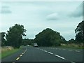 N5760 : A curve in the N52 between Ballymaghery and Cartenstown by Eric Jones
