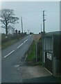 J2240 : Power lines crossing Laird's Road near Katesbridge by Eric Jones