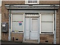 NT9261 : Old shop front, Ayton by Graham Robson