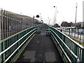 Up a long ramp to Mountain Ash railway station footbridge