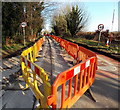 Yellow and orange barriers along Cirencester Road, Tetbury