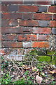 Benchmark on East End House outbuilding, Kiln Lane