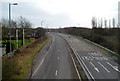 SS7492 : Motorway slip road passes Port Talbot Premier Inn, Baglan by Jaggery
