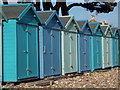 Mudeford: pastel blue beach huts at Friars Cliff