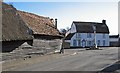 Fowlmere: weatherboarding and war memorial