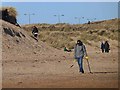 NZ3278 : Treasure hunting on South Beach, Blyth by Oliver Dixon