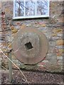 Former mill wheel-now incorporated into the building wall at Littleton Mill