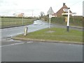 Signpost on a triangular green, Lees Road