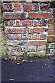 Weathered benchmark on end of wall between #202/#204 Iffley Road