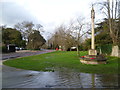 East Malling War Memorial and a flooded Church Walk