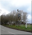 Signpost and Power Transformer at Fourlane Ends