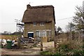 Thatched cottage by the bridleway