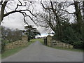 The  gated  drive  to  Busby  Hall