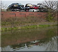 Scrap cars along the Grand Union Canal