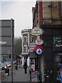 Signs on Stile Hall Parade, Chiswick High Road, W4