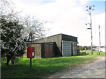 TG3427 : Sheds and postbox in Chapel Road, East Ruston by Evelyn Simak