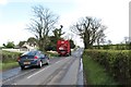 J0330 : Agricultural traffic on the B133 south of Ewart's Cross Roads by Eric Jones