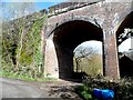 Private road passes through arch of viaduct