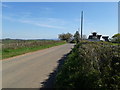 The B3188 heading south, with the Old School House having repairs made to the chimney