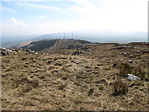 J0425 : The descent towards the telecommunications masts from the summit of Camlough Mountain by Eric Jones